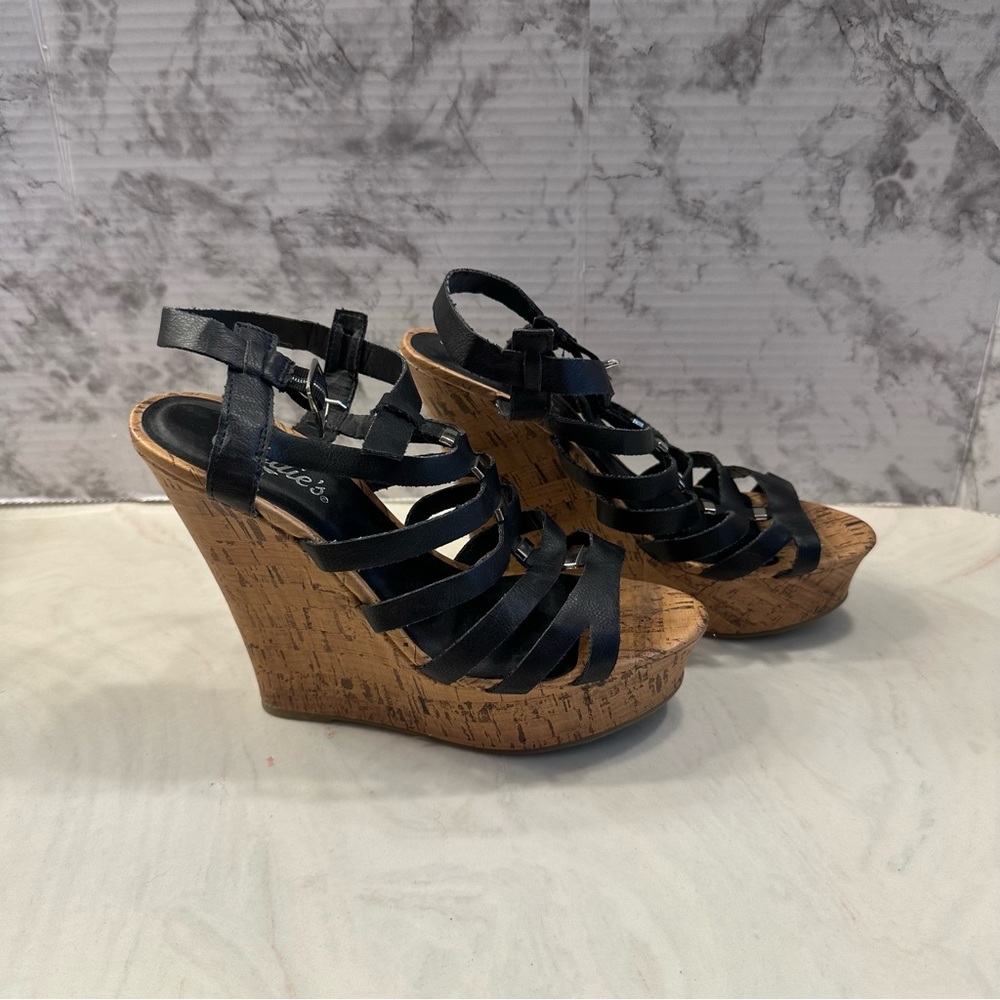 Candie’s black caged wedges